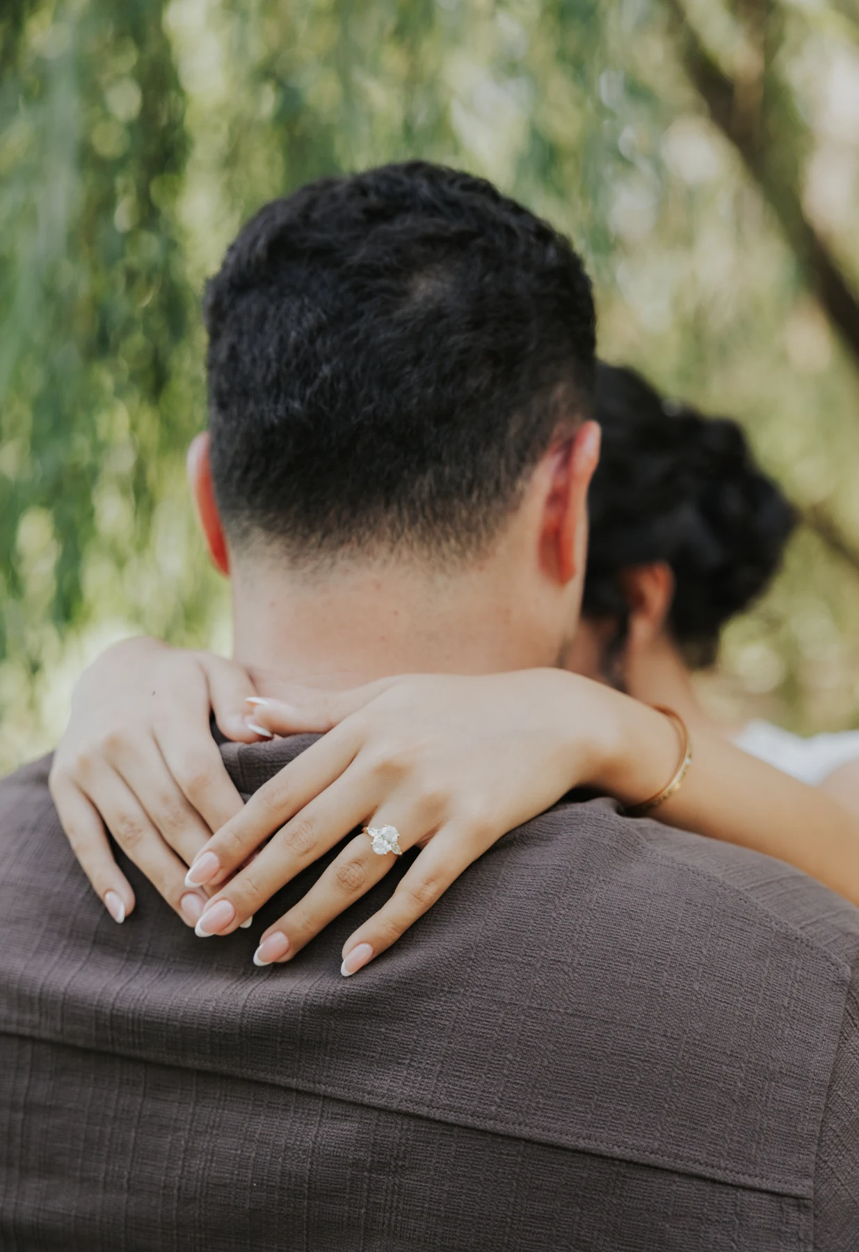 Karen’s engagement ring as she embraces Pablo